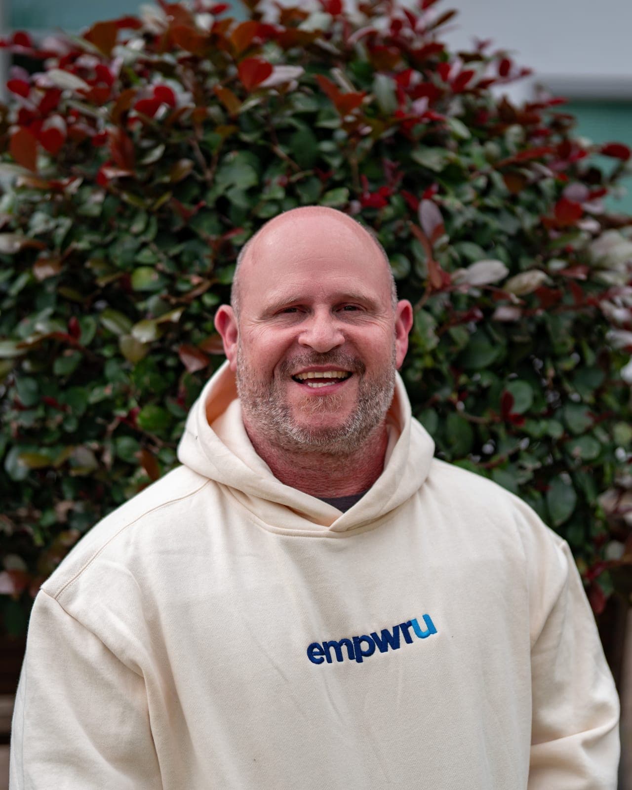 Josh Brewer, founder of EmpwrU Support Services, in an EmpwrU hoodie
