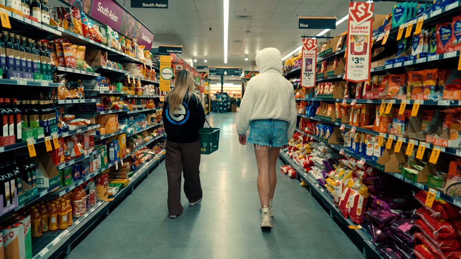 A participant and her EmpwrU support worker doing the shopping together